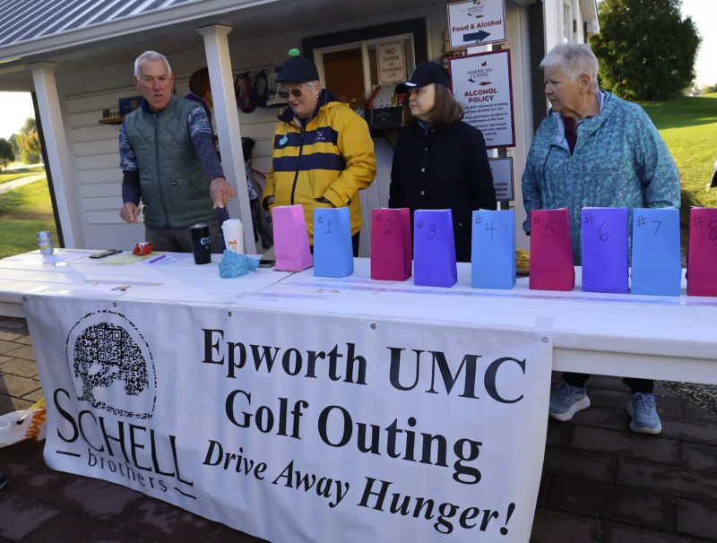 Organizing the auction items for bid at the Epworth Drive Away Hunger event are (l-r) David Streit, co-chair, and volunteers Linda BenderHilt, Ethel Cabry and Sue Brenton. SUBMITTED PHOTOS